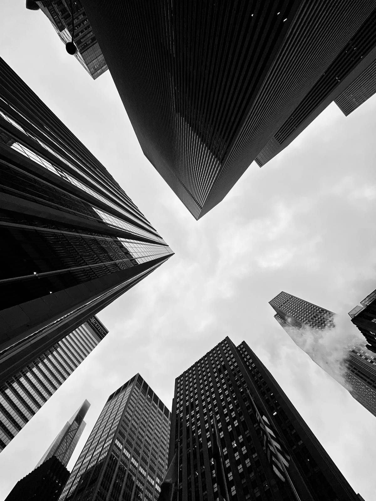 Office towers in a financial district, photographed from street level looking up